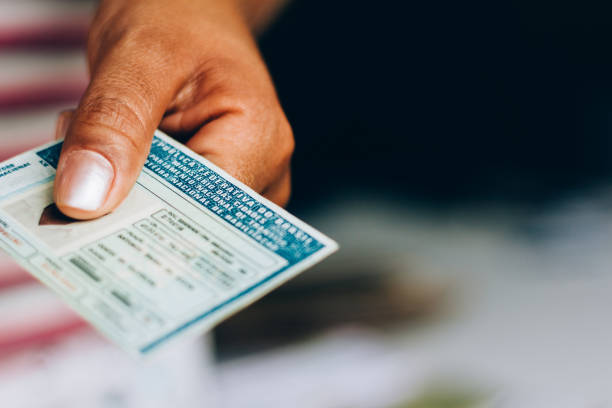 Man holds National Driver's License (CNH). Official document of Brazil, which attests the ability of a citizen to drive land vehicles.