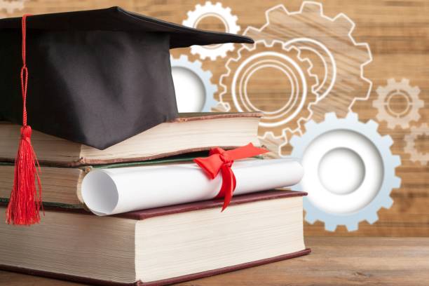 Graduation hat and stacks of books